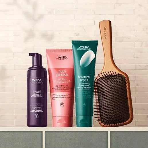 Aveda haircare products and an Aveda paddle brush at LuLu Salon