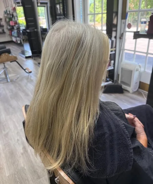 Long, smooth ash blonde color in the LuLu Salon chair