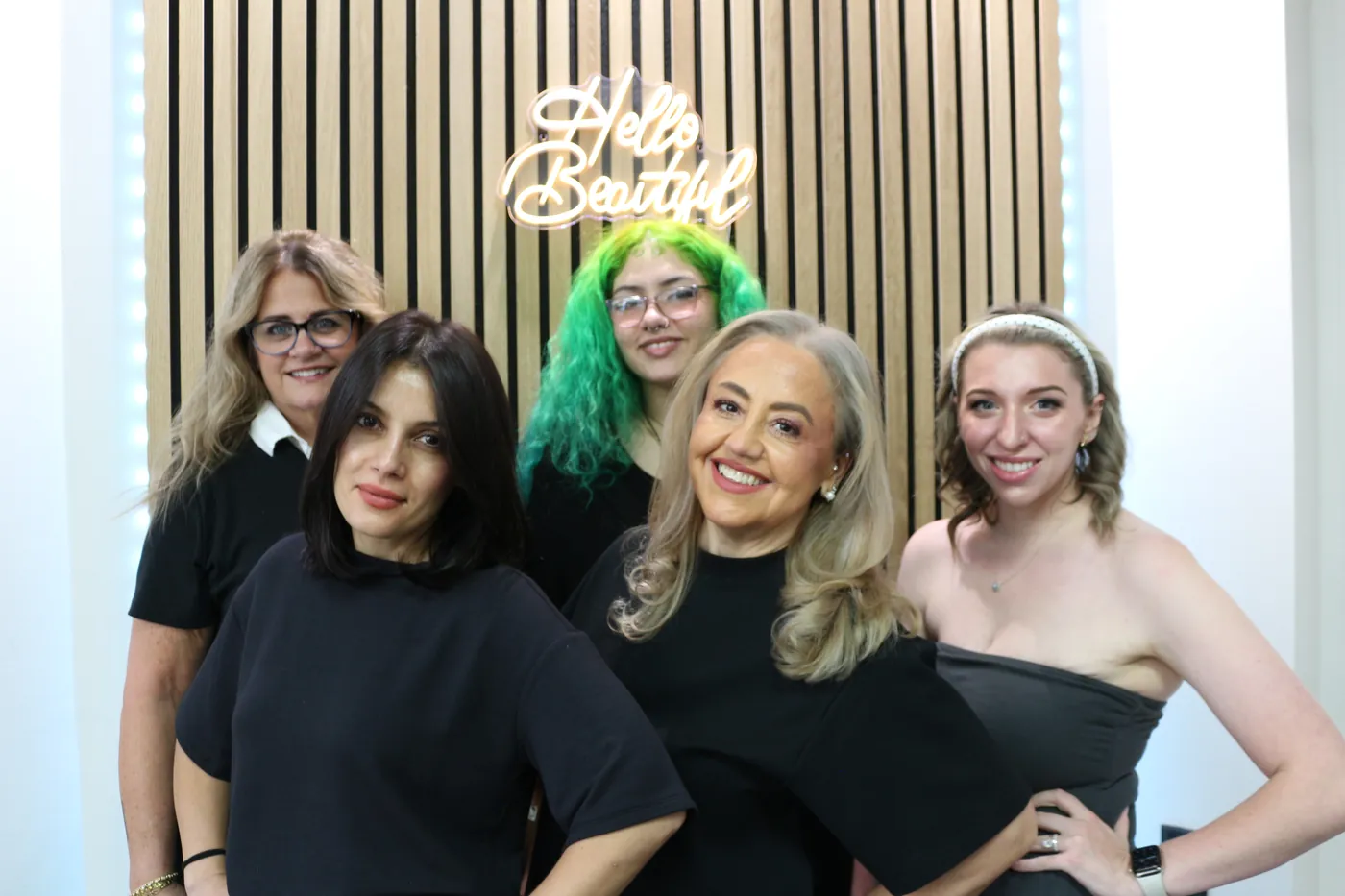 The LuLu Salon team under the Hello Beautiful sign